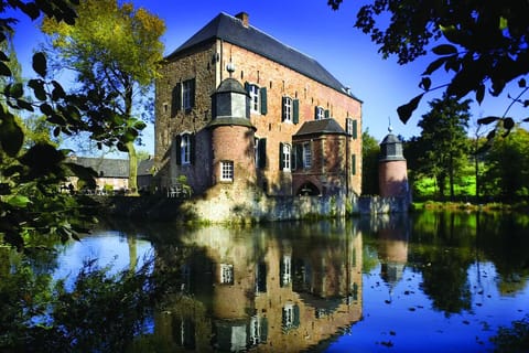 Lose yourself in fairytale castle views mirrored on the moat.