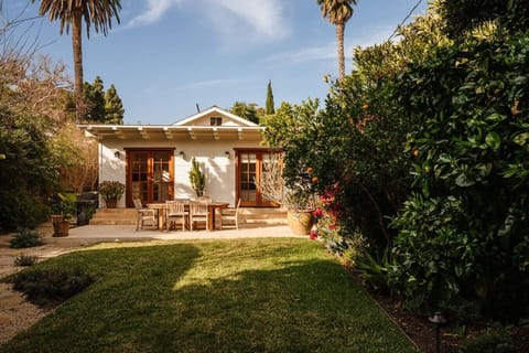 Charming craftsman bungalow with a sun-drenched patio, alfresco dining, and lush landscaping — your private retreat awaits.