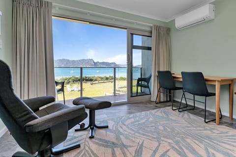 Elevated harbour outlook: Panoramic views across the water toward Mt Manaia from the comfort of the living space.