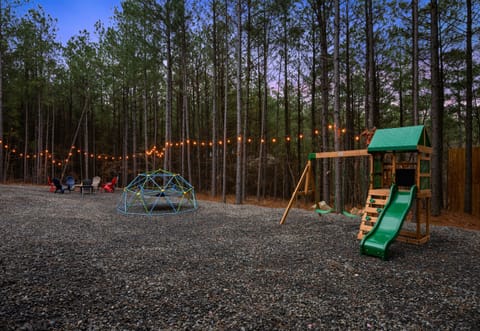 The spacious outdoor area offers plenty of room for yard games, exploring the trees, or simply enjoying time outside together.