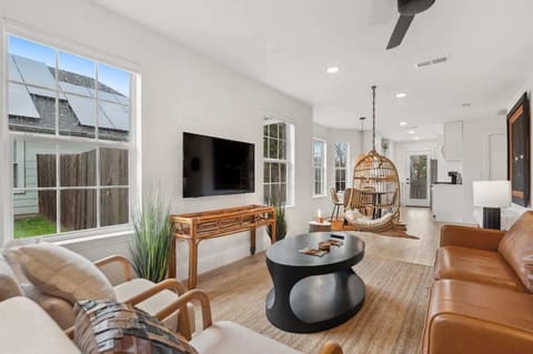 Open living space with comfortable seating and smart TV for movie nights.