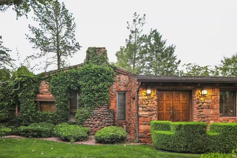 Arrive to charming stone cottage vibes and lush greenery.