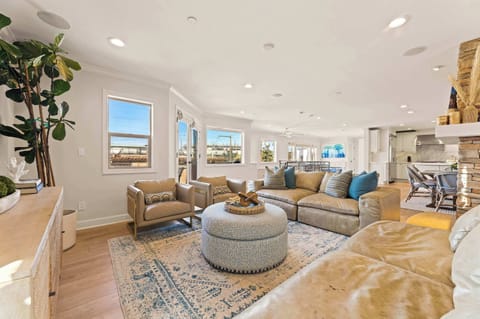 A bright living room designed for gathering, conversation, and relaxed moments together during your stay.