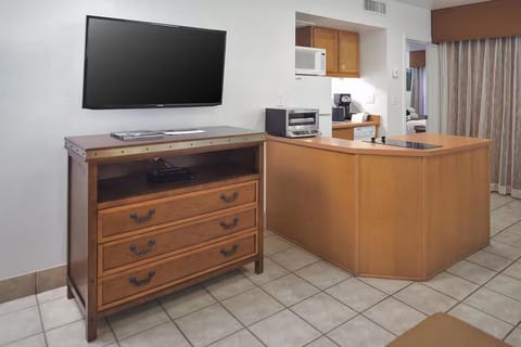 Settle in with entertainment and handy kitchenette essentials nearby