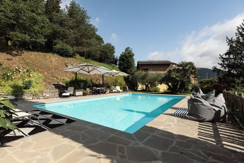 Swimming Pool, Outdoor Furniture, Resort, Flagstone, Umbrella, Composite Material, Leisure, Eco Hotel, Chair, Shade