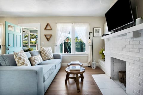 Unwind by the fireplace in our sun-drenched living room, where cozy vibes and stylish touches make you feel right at home from the moment you arrive.