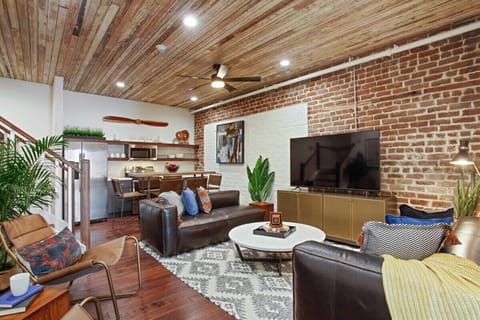 Unit A Living Room | Comfortable Seating Area and TV | First Floor of Third Floor Unit