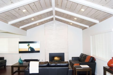 Living room with fireplace and 65" Smart TV
