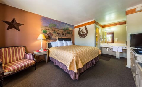 Sink into a restful king bed with comfortable seating nearby.