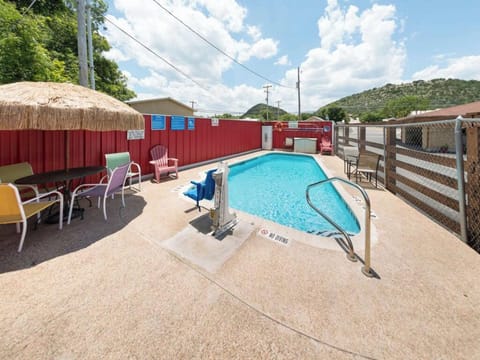 Lounge together beside the pool with plenty of deck space.