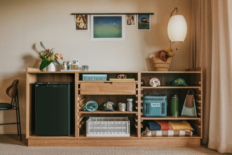 Stock the mini-fridge and keep essentials neatly organized.