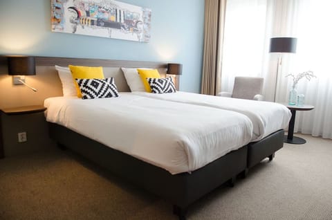 Wake up refreshed in airy beds dressed in crisp white.