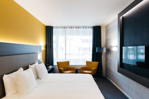 Stretch out on plush bedding with a relaxed seating nook.