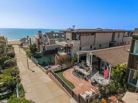 Enjoy ocean views just steps away, with a front patio designed for relaxed outdoor living and easy access to the beach.
