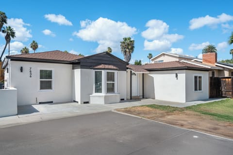 Front exterior view with private driveway and clean, modern finish.