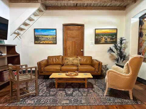 Gather around for family game night in the inviting living room, complete with board games and comfortable seating.
