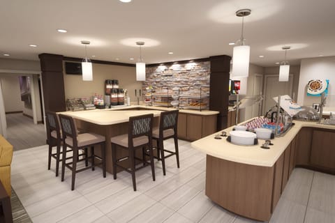 Complimentary breakfast area with warm and inviting ambiance.