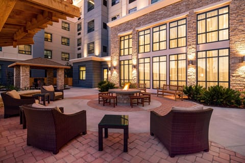 Cozy outdoor courtyard seating area with a fire pit.