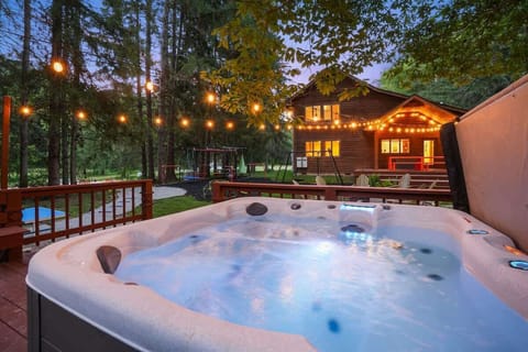 Hot Tub Paradise: Soak under the stars surrounded by nature’s beauty and twinkling lights!
