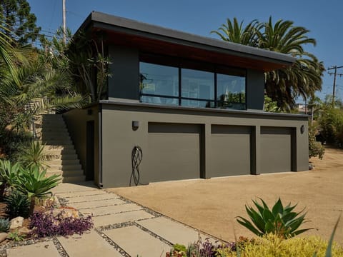 Exterior shot of your studio (please note the driveway and EV charger are reserved for the main house, your parking is above the studio on the other side)Exterior shot of your studio (please note the driveway and EV charger are reserved for the main house