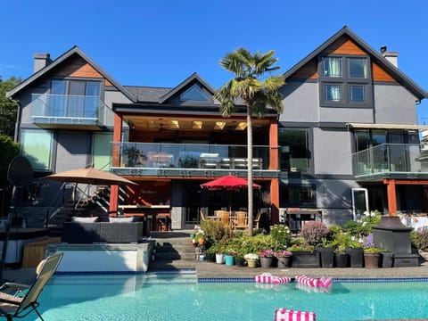 Exterior, 2 fire tables, mulitiple dining/seating, bar, hottub, pool 