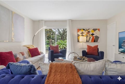 big living room with 2 sofa, 2 chairs, 60 " TV for comfy seating for group