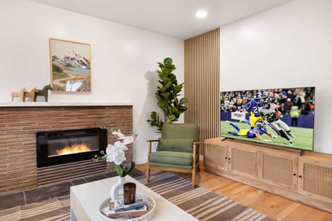 Relaxing living room with a sleek fireplace and smart TV for cozy nights in.