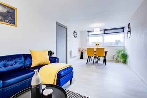 Bright modern living space with cozy seating and dining area

