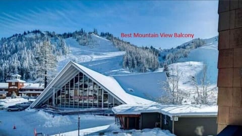 Balcony view with two high-rise Adirondack chairs to kick back and enjoy the view with and favorite treat. The Funitel Gondola is just out of the frame to the right, Squaw Kid's Ski-School and Child center just steps out the door.