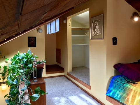 The closet has room for lots of clothes and storage. Book nook around the corner