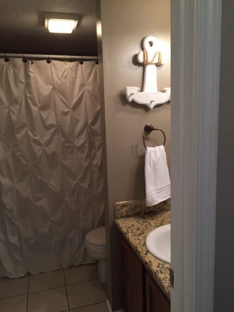 Combined shower/tub, hair dryer, towels, toilet paper