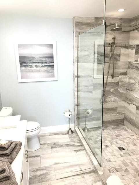 Master ensuite bathroom's tiled walk-in shower