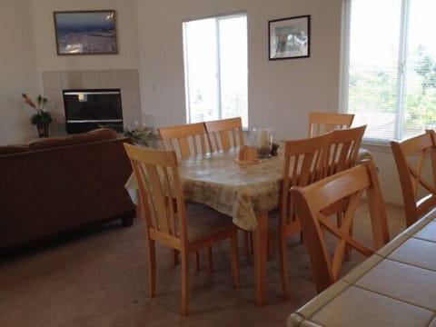 This dining table is expandable to 8 persons and there is counter seating for 4.