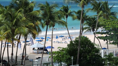 On the beach, sun loungers, beach umbrellas, beach towels