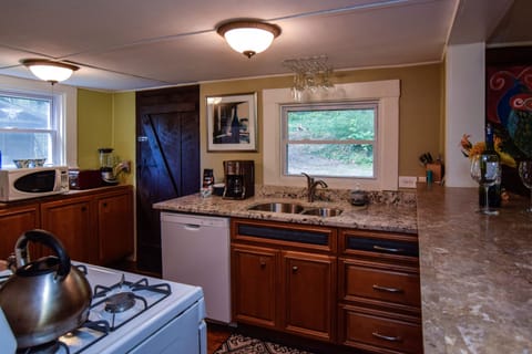 Sweet little kitchen w granite countertops and well stocked pots pans dishes etc
