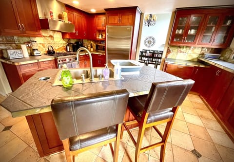 Modern chiefs kitchen. Large selection of pots, knives, pans & cooking utensils