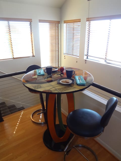 The cafe table at the end of the kitchen is a great place for morning coffee.