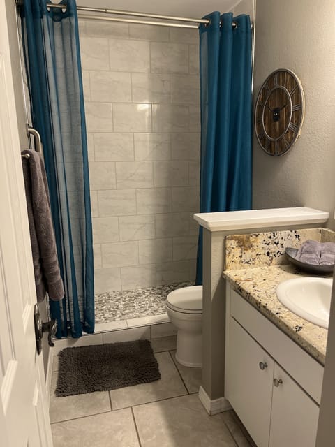 Combined shower/tub, hair dryer, towels, soap