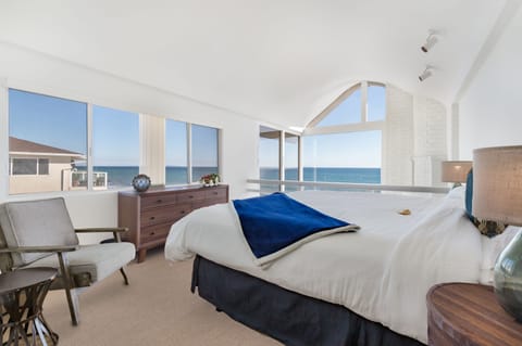Primary bedroom has panoramic oceanfront views and an en-suite bathroom