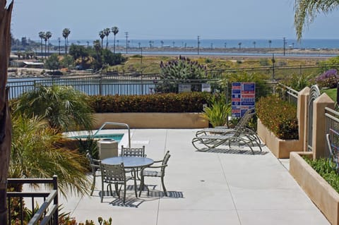 lower patio with hot tub taken from PRIVATE PATIO. ACTUAL LAGOON & OCEAN VIEW.