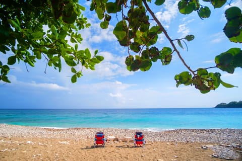 On the beach, sun loungers, beach towels