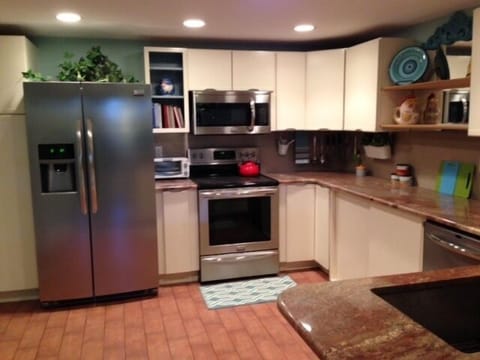 Beautifully equipped kitchen.Lots of granite counter space/stainless appliances.