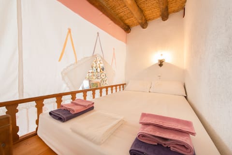 "Apokrevatos": traditional wooden loft double bed. The newlyweds’ bedroom.