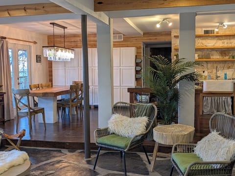 Always improving-Rough "true" cedar wall in dining area.  Custom table RH light.