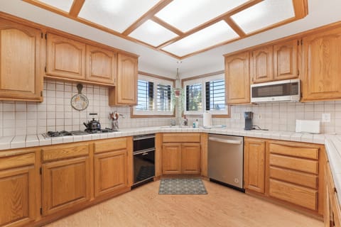 Full Kitchen with everything youll need for meals, new cookware, flatwear, etc