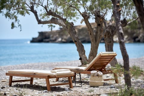 On the beach, sun loungers, beach umbrellas, beach towels