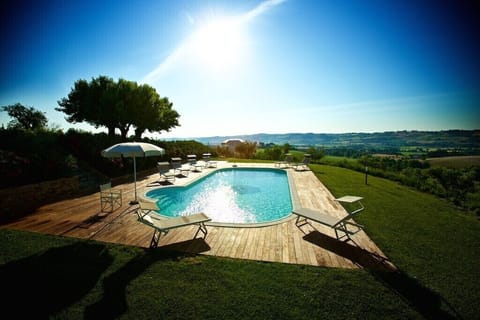 A heated pool, sun loungers