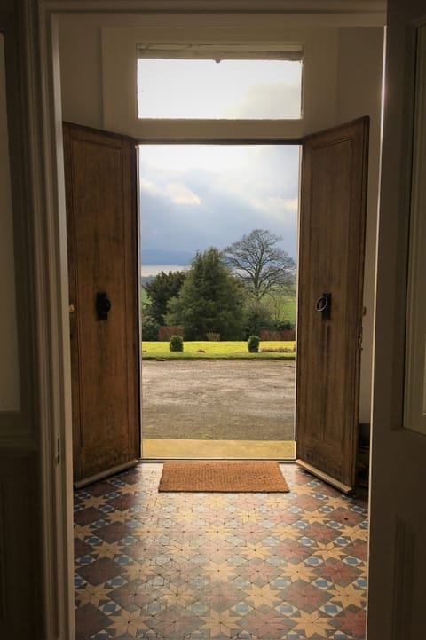 Looking out of the front door, over the trees and down to the Loch