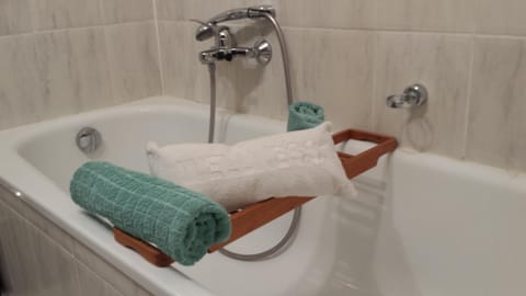 Bathtub, hair dryer, towels