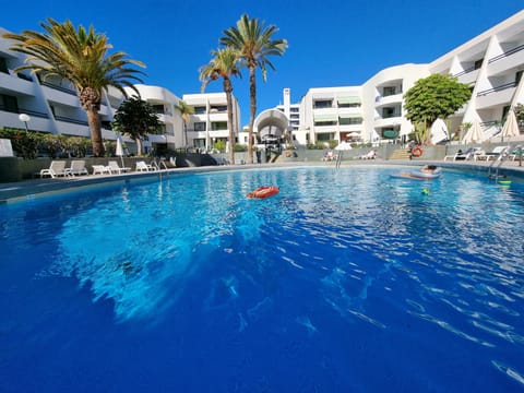 A heated pool, sun loungers